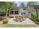Large patio with a dining set for six, perfect for outdoor entertaining in a private backyard at 2704 Farnborough Rd, Raleigh, NC 27613