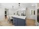 Spacious kitchen with a large island featuring a white countertop and stainless steel appliances, perfect for entertaining at 2704 Farnborough Rd, Raleigh, NC 27613