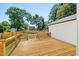 Spacious wooden back deck, perfect for outdoor entertaining with fenced yard and green space at 2803 Atlantic St, Durham, NC 27707