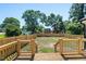 Raised wood deck overlooking a backyard enclosed with a wood fence at 2803 Atlantic St, Durham, NC 27707