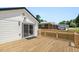 Back deck of a home featuring wood decking with a sliding glass door to the interior at 2803 Atlantic St, Durham, NC 27707