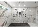 Amazing frameless shower featuring black hardware and multiple shower heads and body sprays at 2803 Atlantic St, Durham, NC 27707
