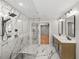Modern bathroom with dual vanity, frameless glass shower, and black fixtures at 2803 Atlantic St, Durham, NC 27707