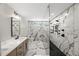 Stunning bathroom featuring marble-patterned tile, double vanity, toilet, and luxurious shower at 2803 Atlantic St, Durham, NC 27707