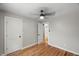 Neutral bedroom with hardwood floors, a ceiling fan and natural light at 2803 Atlantic St, Durham, NC 27707