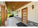 Stylish front porch with wood ceiling, front door, ceiling fan and room for outdoor relaxation at 2803 Atlantic St, Durham, NC 27707