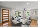 Virtual staged living room features hardwood floors, fresh paint, and natural light at 2803 Atlantic St, Durham, NC 27707