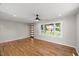 Bright and airy living room with hardwood floors, fresh paint, and modern ceiling fan at 2803 Atlantic St, Durham, NC 27707