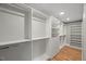 Walk-in closet with open storage, shelves, drawers and hardwood floors at 2803 Atlantic St, Durham, NC 27707