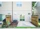 A compact back patio offers an intimate outdoor area with a sliding glass door and privacy fencing on each side at 2808 Carter Finley Pl, Raleigh, NC 27606