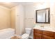 Full bathroom with tiled shower/tub and wood vanity at 2808 Carter Finley Pl, Raleigh, NC 27606