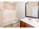 This bathroom features a large mirror, vanity with sink, and a shower/tub combo at 2808 Carter Finley Pl, Raleigh, NC 27606