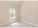 This bedroom features neutral paint colors and a window at 2808 Carter Finley Pl, Raleigh, NC 27606