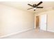 Neutral carpeted bedroom with ceiling fan and access to attached bathroom at 2808 Carter Finley Pl, Raleigh, NC 27606