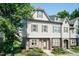 Charming two-story townhome featuring stone accents, neutral siding, and well-maintained landscaping at 2808 Carter Finley Pl, Raleigh, NC 27606