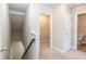 Hallway with closet and access to the bathroom, carpeted floors, neutral paint at 2808 Carter Finley Pl, Raleigh, NC 27606