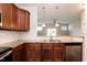 The kitchen features granite counters, stainless steel appliances, and dark wood cabinetry at 2808 Carter Finley Pl, Raleigh, NC 27606