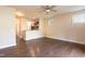 Open-concept living room features hardwood floors, a ceiling fan, and easy access to the kitchen at 2808 Carter Finley Pl, Raleigh, NC 27606