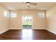 A spacious living room boasts hardwood floors, a ceiling fan, and a sliding glass door to the patio at 2808 Carter Finley Pl, Raleigh, NC 27606