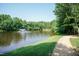 Scenic view of the community pond with walking trail and fountain at 2808 Carter Finley Pl, Raleigh, NC 27606