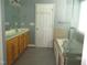 Bathroom with a double sink vanity, tile flooring, soaking tub, and a separate shower at 3008 River Hill Ln, Burlington, NC 27217