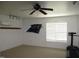 Carpeted bedroom with ceiling fan, track lighting, mini-split system, and a Carolina Panthers logo on the wall at 3008 River Hill Ln, Burlington, NC 27217