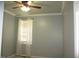 Well-lit bedroom with a ceiling fan and light fixture and a bright window with white blinds and curtains at 3008 River Hill Ln, Burlington, NC 27217