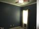 Bedroom with ceiling fan and a bright window with curtains allowing natural light into the room at 3008 River Hill Ln, Burlington, NC 27217
