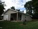 Detached outbuilding with covered area, providing extra storage or workspace on the property at 3008 River Hill Ln, Burlington, NC 27217