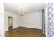 Spacious bedroom with hardwood floors and ornate curtains and trim throughout at 3112 Lake Pointe Trl, Rocky Mount, NC 27804
