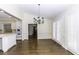 Dining room with hardwood floors and modern chandelier fixture at 3112 Lake Pointe Trl, Rocky Mount, NC 27804