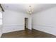 Elegant dining room with hardwood floors, crown molding, and chandelier at 3112 Lake Pointe Trl, Rocky Mount, NC 27804