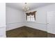 Traditional dining room featuring hardwood floors, crown molding, and a chandelier at 3112 Lake Pointe Trl, Rocky Mount, NC 27804