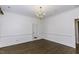 Elegant dining room with hardwood floors, crown molding, and doorway to another room at 3112 Lake Pointe Trl, Rocky Mount, NC 27804