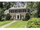 Stately brick home with dormer windows, black shutters, and a well-manicured lawn at 3112 Lake Pointe Trl, Rocky Mount, NC 27804