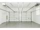 Garage with two-car capacity, bright lighting, and a white painted interior at 3112 Lake Pointe Trl, Rocky Mount, NC 27804