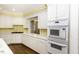 Modern kitchen with stainless steel double ovens and bright white cabinetry at 3112 Lake Pointe Trl, Rocky Mount, NC 27804