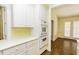 Kitchen with built-in oven and microwave, white cabinets, and view into dining area at 3112 Lake Pointe Trl, Rocky Mount, NC 27804