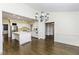 Spacious kitchen featuring a central island, stainless steel appliances, and seamless access to the dining area at 3112 Lake Pointe Trl, Rocky Mount, NC 27804