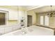 Bright kitchen featuring white cabinets and stainless steel appliances, plus a view into the dining area at 3112 Lake Pointe Trl, Rocky Mount, NC 27804