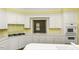 Well-lit kitchen with white cabinetry, a gas cooktop, and solid surface countertops at 3112 Lake Pointe Trl, Rocky Mount, NC 27804