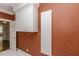 Laundry room featuring unique wall coverings and ample wall storage at 3112 Lake Pointe Trl, Rocky Mount, NC 27804