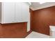 Laundry room featuring wall storage and rich, decorative paint at 3112 Lake Pointe Trl, Rocky Mount, NC 27804