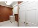Well-lit laundry room with a utility sink and storage cabinets at 3112 Lake Pointe Trl, Rocky Mount, NC 27804
