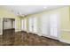 Living room with light yellow walls, tile floors, and French doors at 3112 Lake Pointe Trl, Rocky Mount, NC 27804