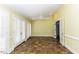 Living room with light yellow walls, tile floors, and French doors at 3112 Lake Pointe Trl, Rocky Mount, NC 27804