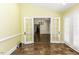 Living room with tile floors, French doors, and view to another room at 3112 Lake Pointe Trl, Rocky Mount, NC 27804