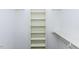 Bright, organized walk-in closet with white shelving, perfect for storage and maximizing space at 3112 Lake Pointe Trl, Rocky Mount, NC 27804