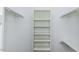 Well-organized walk-in closet featuring built-in shelving and hanging rods, maximizing storage efficiency at 3112 Lake Pointe Trl, Rocky Mount, NC 27804