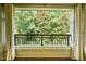 Spacious balcony overlooking lush greenery with decorative metal railing at 3701 Baron Cooper Pass # 303, Raleigh, NC 27612